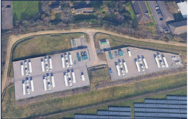 Aerial view of an Opium Power battery storage site adjacent to a solar array